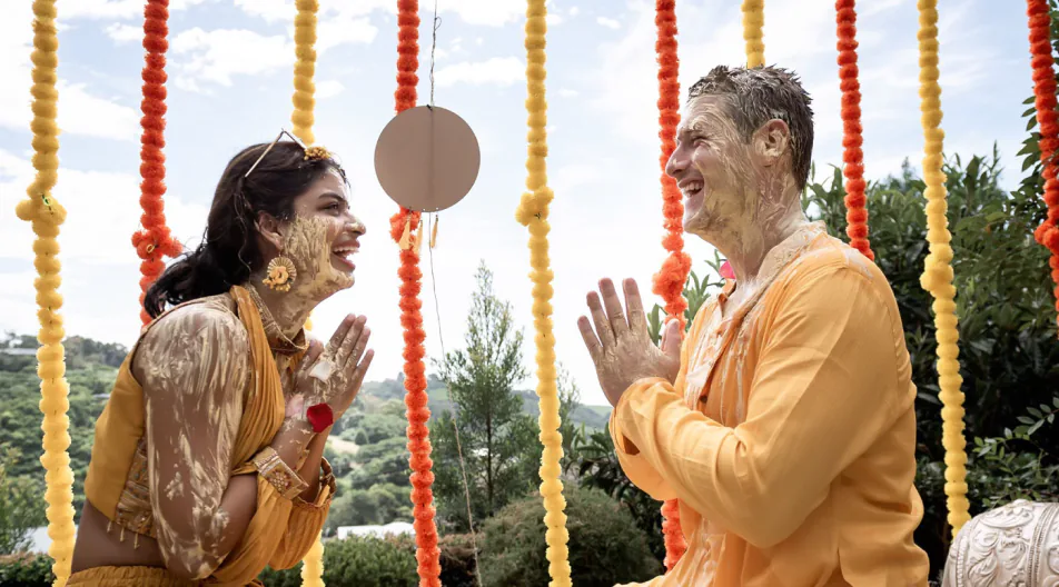 Couple laughing together during a candid Grand House session